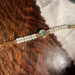 Vintage Lucoral Women's Gold Plated Quartz Watch with Multi-Strand Pearl Bracele